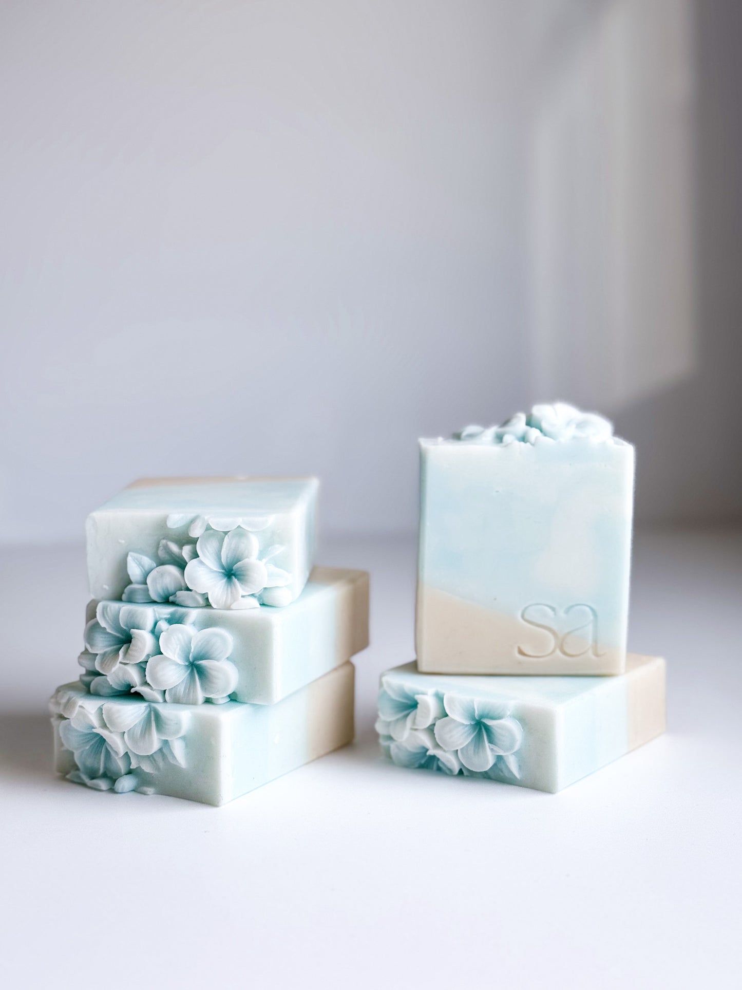 Sea salt and orchid handmade soap bar with ocean wave design and flower topper by Sweet Aurora