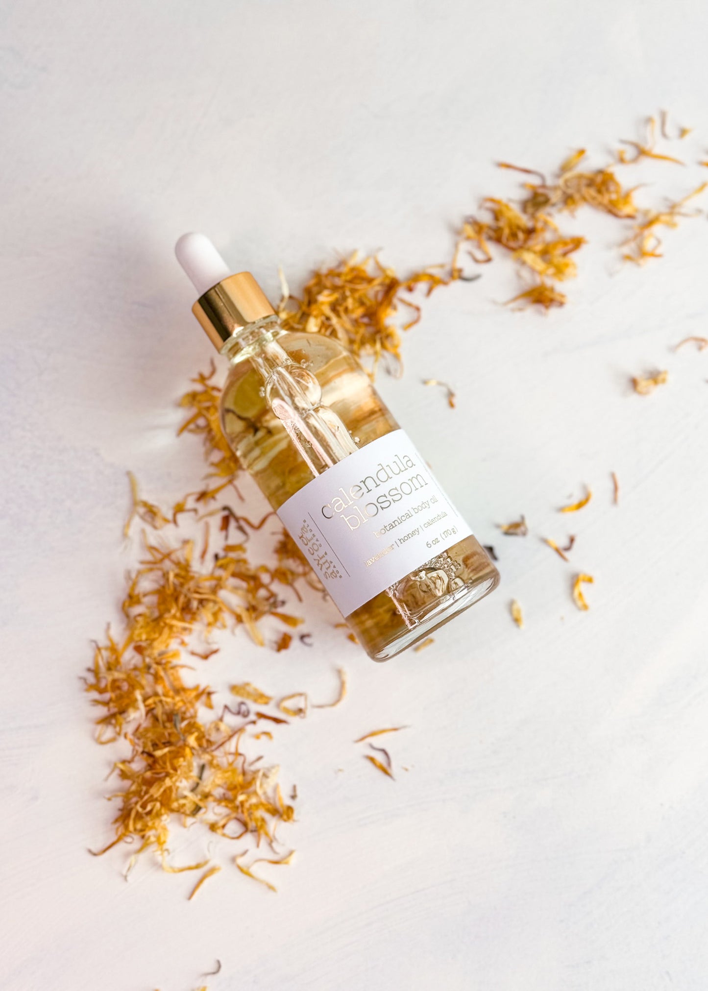 Calendula Blossom moisturizing body oil with calendula petals