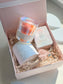 Gift set with a candle, meditation cards, and wick trimmer in a decorative box.