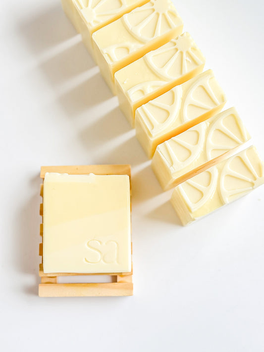 Amalfi Citrus soap bars by Sweet Aurora with yellow ombré stripes and lemon-inspired tops