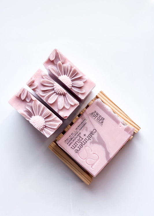 Cashmere Plum handmade artisan soap with blush pink swirl and daisy topper by Sweet Aurora