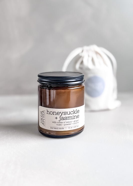 Honeysuckle Jasmine soy cotton wick candle in amber jar with branded gift bag