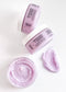 Lavender + Amber gentle exfoliating sugar scrub with open jar showing texture