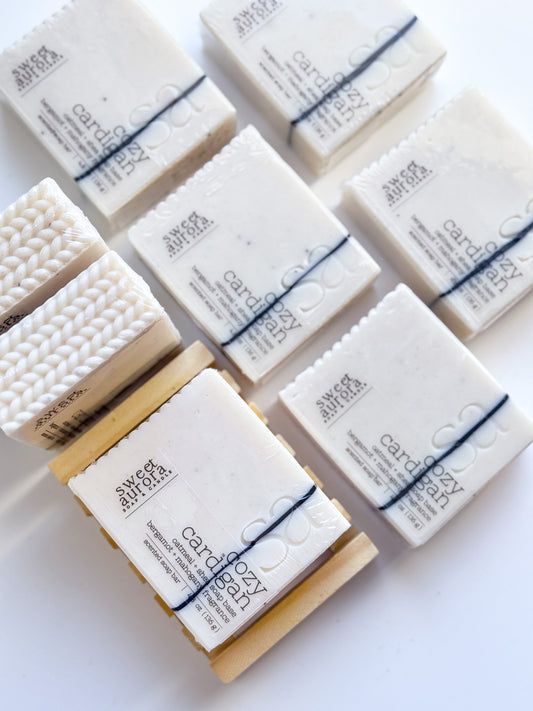 Multiple bars of soap with visible branding on a white background
