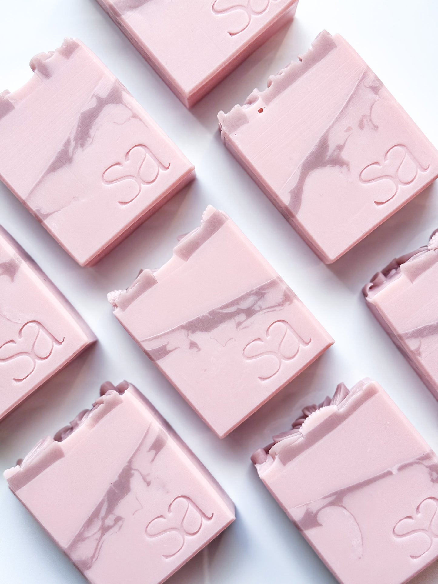 Cashmere Plum handmade artisan soap with blush pink swirl and daisy topper by Sweet Aurora